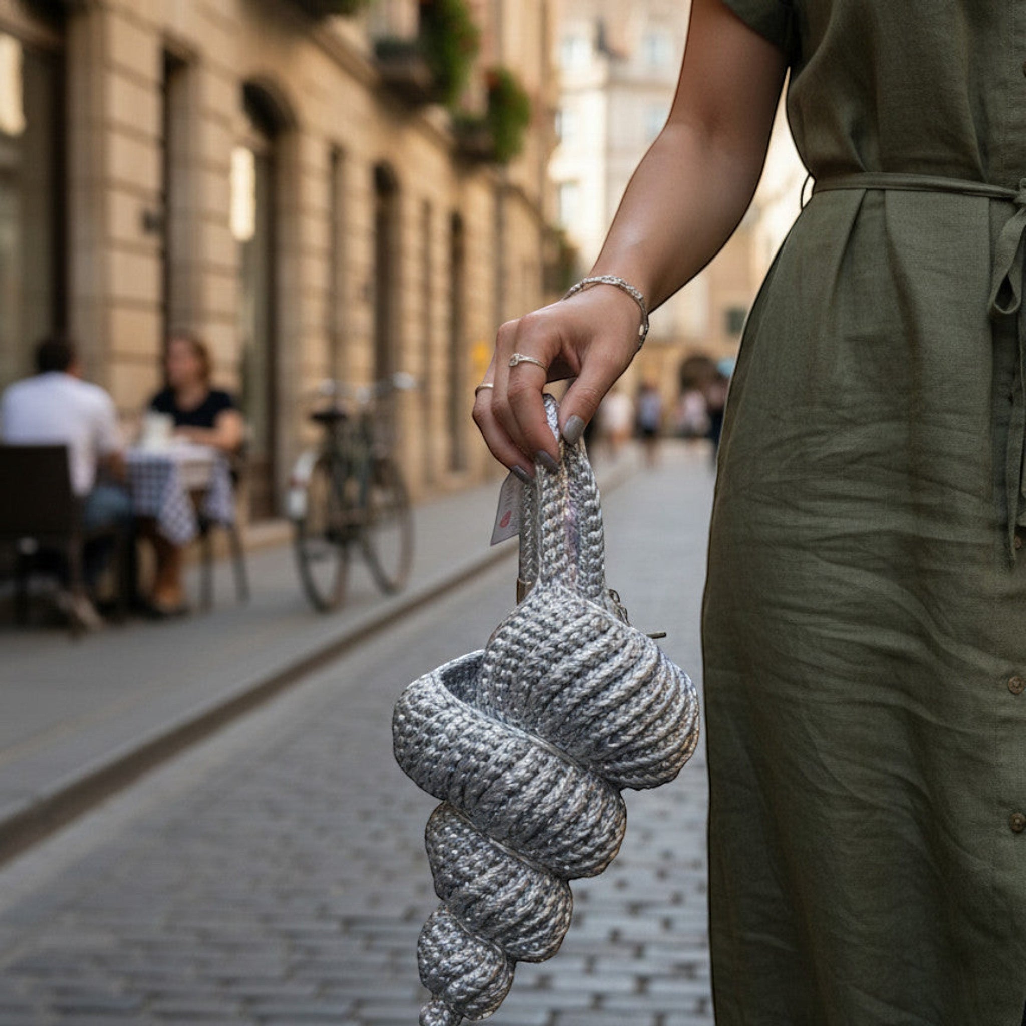 Suzie's Sunshine Dolls silver braided rope bag with unique coiled design and braided strap.