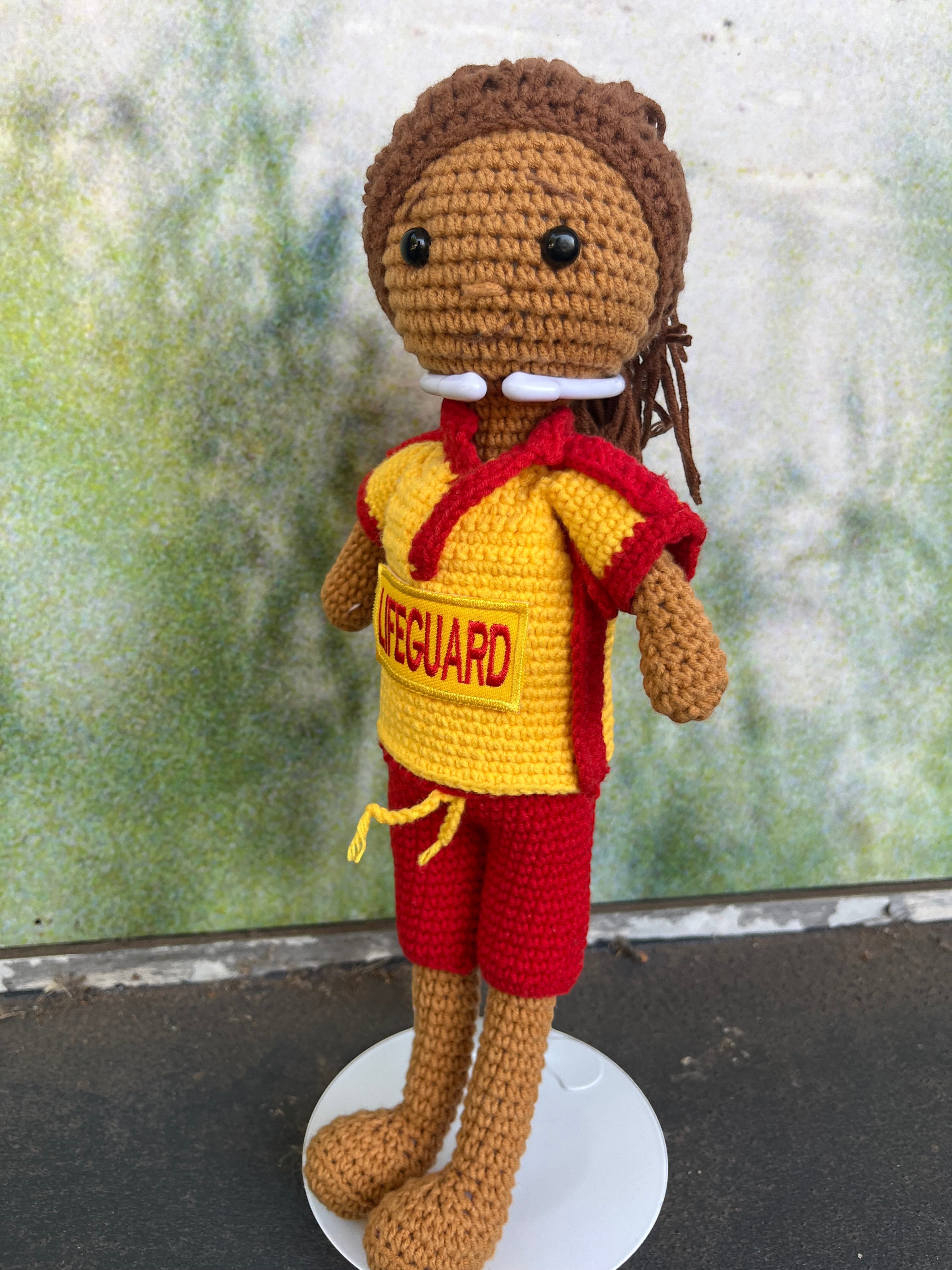 Suzie's Sunshine Dolls Surf Lifesaver doll, handmade crochet, red shorts, yellow rashie with red trim, 'LIFEGUARD' patch.