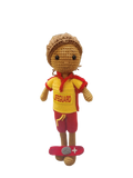 Suzie's Sunshine Dolls handmade crocheted surf lifesaver doll in red and yellow uniform with 'LIFEGUARD' text, standing on a red rescue float.