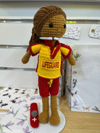 Suzie's Sunshine Dolls Surf Lifesaver doll, crocheted in red and yellow uniform with "LIFEGUARD" text and rescue float accessory.