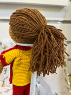 Suzie's Sunshine Dolls Surf Lifesaver doll, crocheted in red and yellow uniform with brown yarn hair.