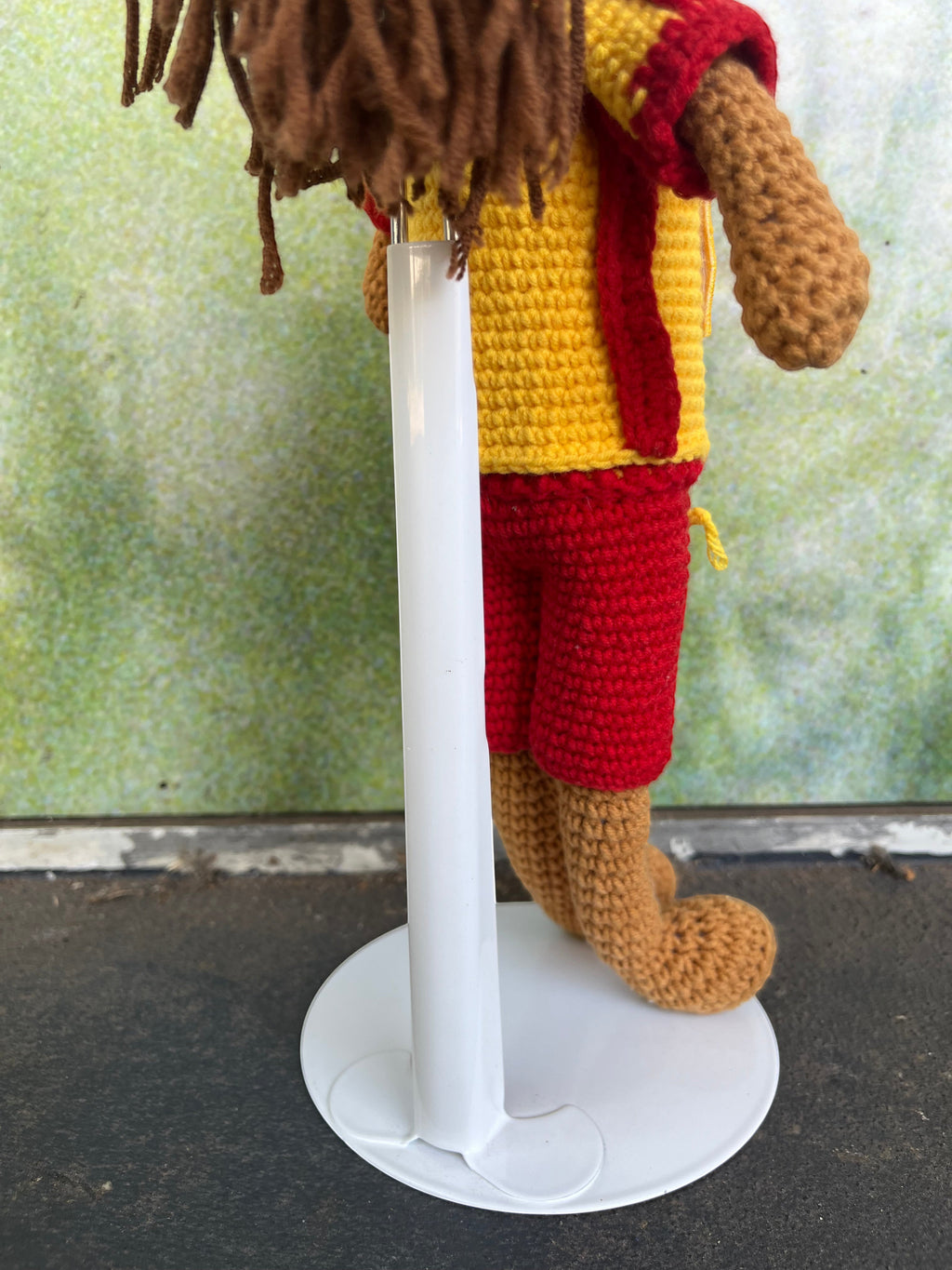Suzie's Sunshine Dolls Surf Lifesaver doll in red shorts and yellow rashie with red trim, crocheted from yarn.