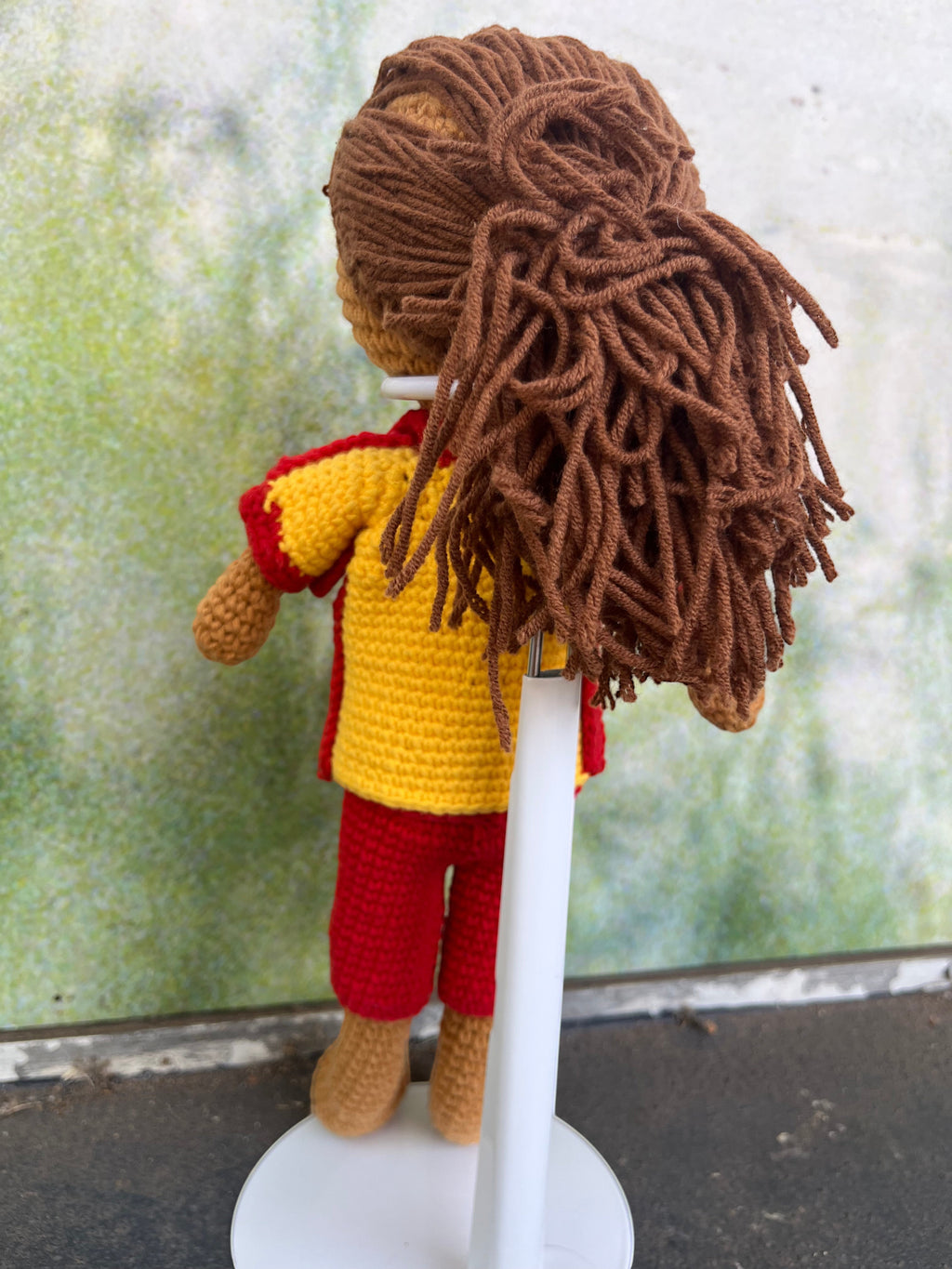 Suzie's Sunshine Dolls Surf Lifesaver doll, crocheted in red shorts and yellow rashie with red trim. Brown yarn hair.