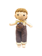 Suzie's Sunshine Dolls Tommy, a hand-crocheted doll with brown hair, wearing brown overalls and a cream shirt. Features button details.