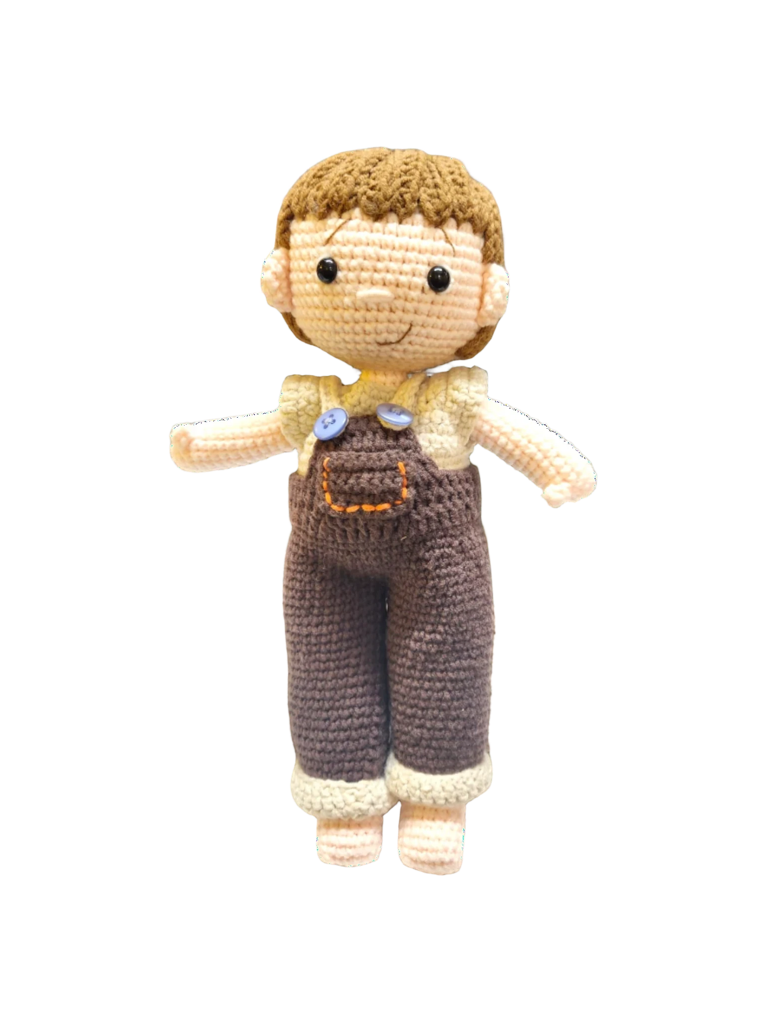 Suzie's Sunshine Dolls Tommy, a hand-crocheted doll with brown hair, wearing brown overalls and a cream shirt. Features button details.