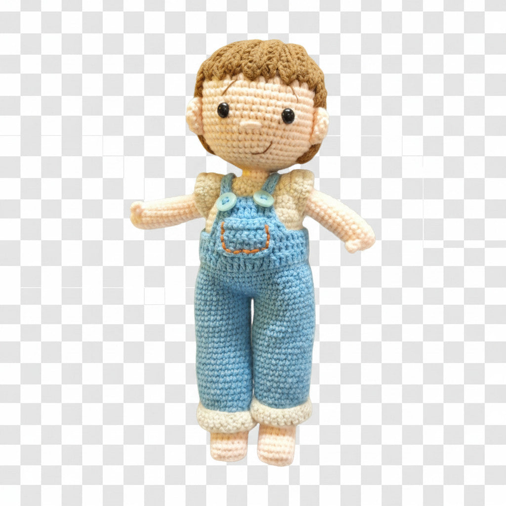 Suzie's Sunshine Dolls Tommy, a hand-crocheted doll with brown hair, wearing blue overalls and a cream shirt. Features button details.