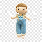 Suzie's Sunshine Dolls Tommy, a hand-crocheted doll with brown hair, wearing blue overalls and a cream shirt. Features button details.