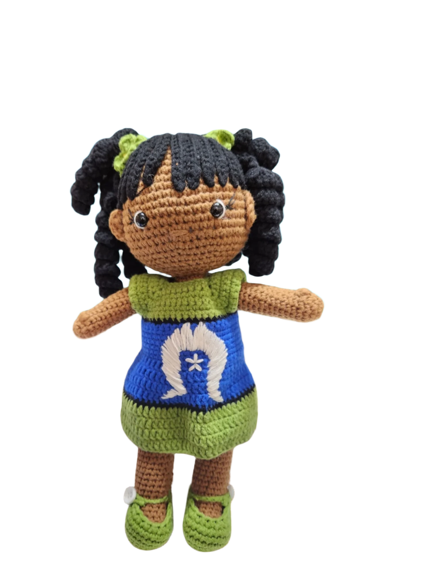 Suzie's Sunshine Dolls handmade crochet doll with long black curly hair, wearing a blue dress with Torres Strait Islander flag design and green trim.