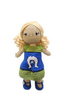 Suzie's Sunshine Dolls Leilani, a handmade crochet doll with blonde curly hair and a blue dress featuring the Torres Strait Islander flag symbol.