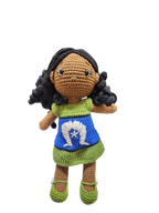 Suzie's Sunshine Dolls handmade crochet doll with long black curly hair and a dress inspired by the Torres Strait Islander flag.