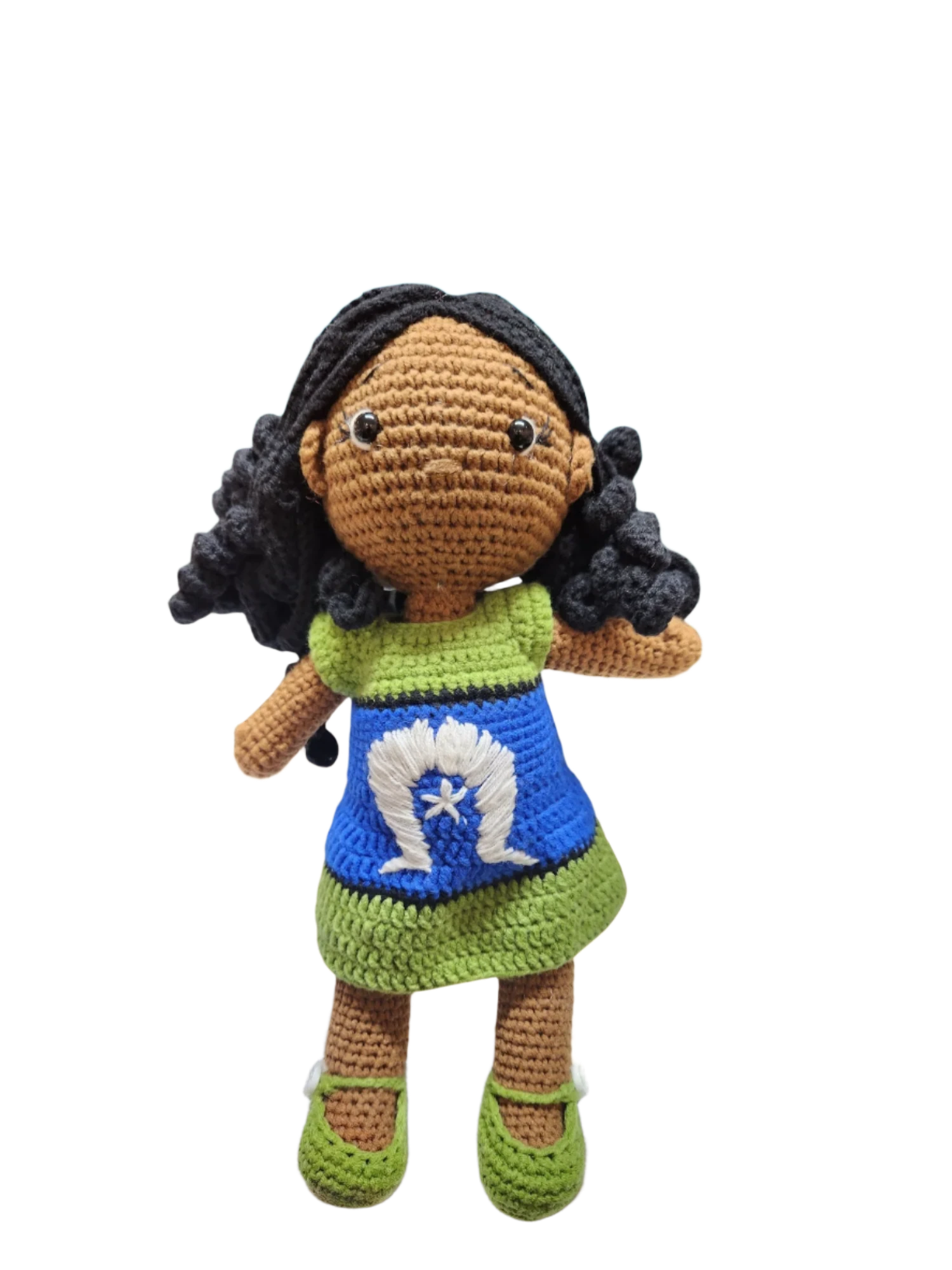 Suzie's Sunshine Dolls handmade crochet doll with long black curly hair and a dress inspired by the Torres Strait Islander flag.