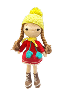 Suzie's Sunshine Dolls Zoey doll in red crocheted dress, yellow beanie with pom-pom, and brown boots.
