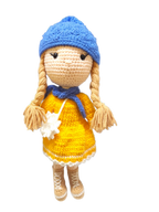 Suzie's Sunshine Dolls Zoey doll in yellow dress, blue hat, blue scarf, and brown boots. Hand-crocheted.